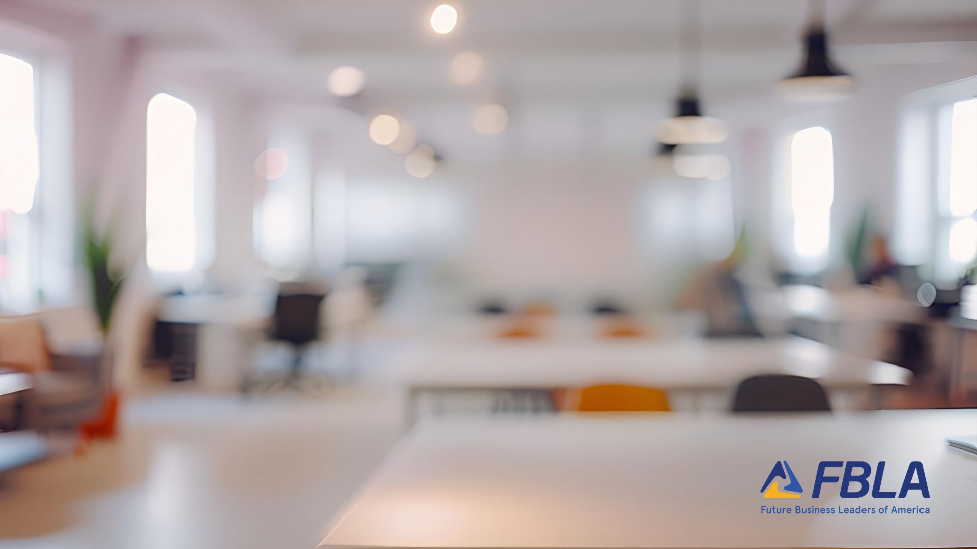 A blurred image of a modern office space with desks and chairs. The FBLA (Future Business Leaders of America) logo is visible in the lower right corner.